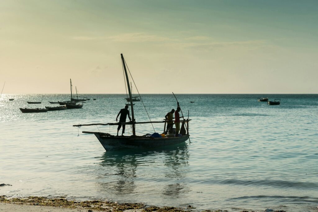 people near wooden fishing ship